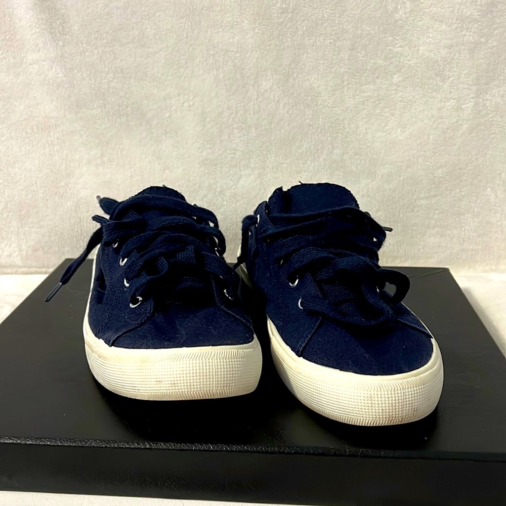 Navy blue sneakers.